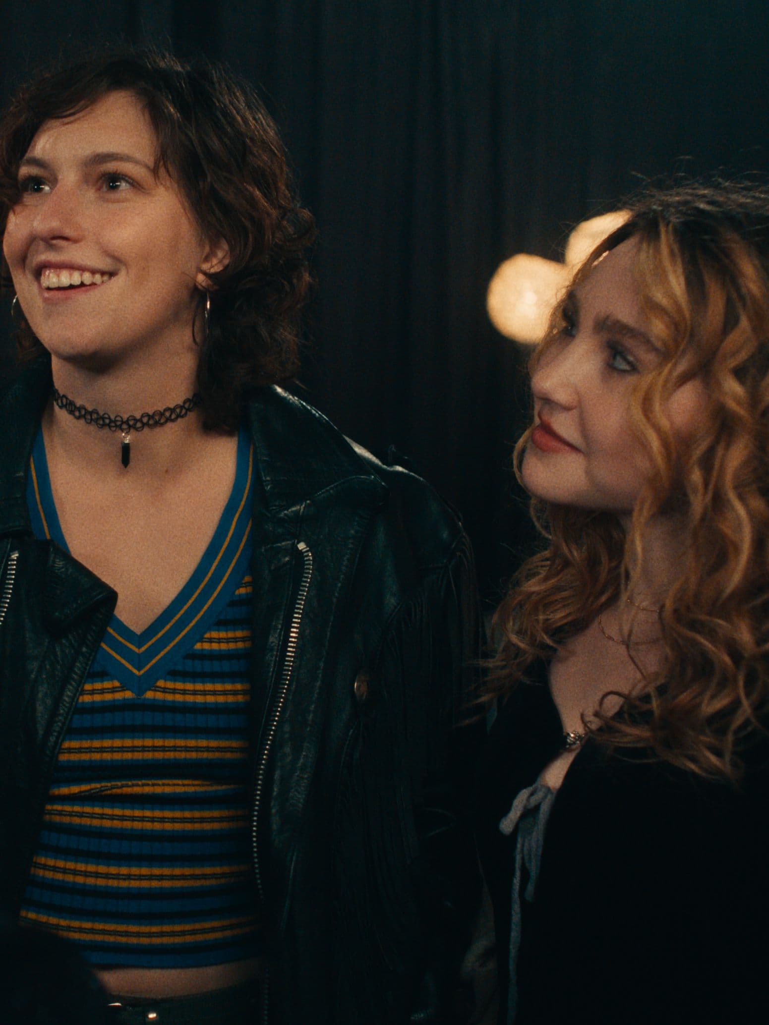 Actors King Princess and Ella Anderson dressed in 90s grunge in a stillfrom Song Sung Blue. 