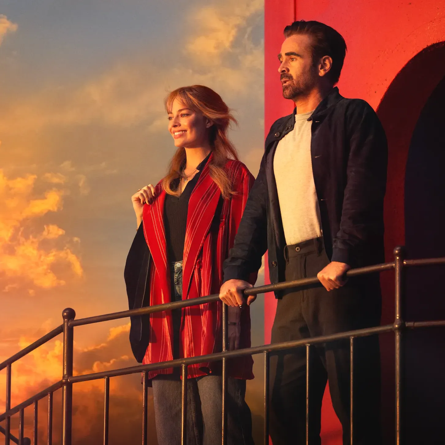 Margot Robbie and Colin Farrell look out from the top of a lighthouse a still from "A Big Bold Beautiful Journey."