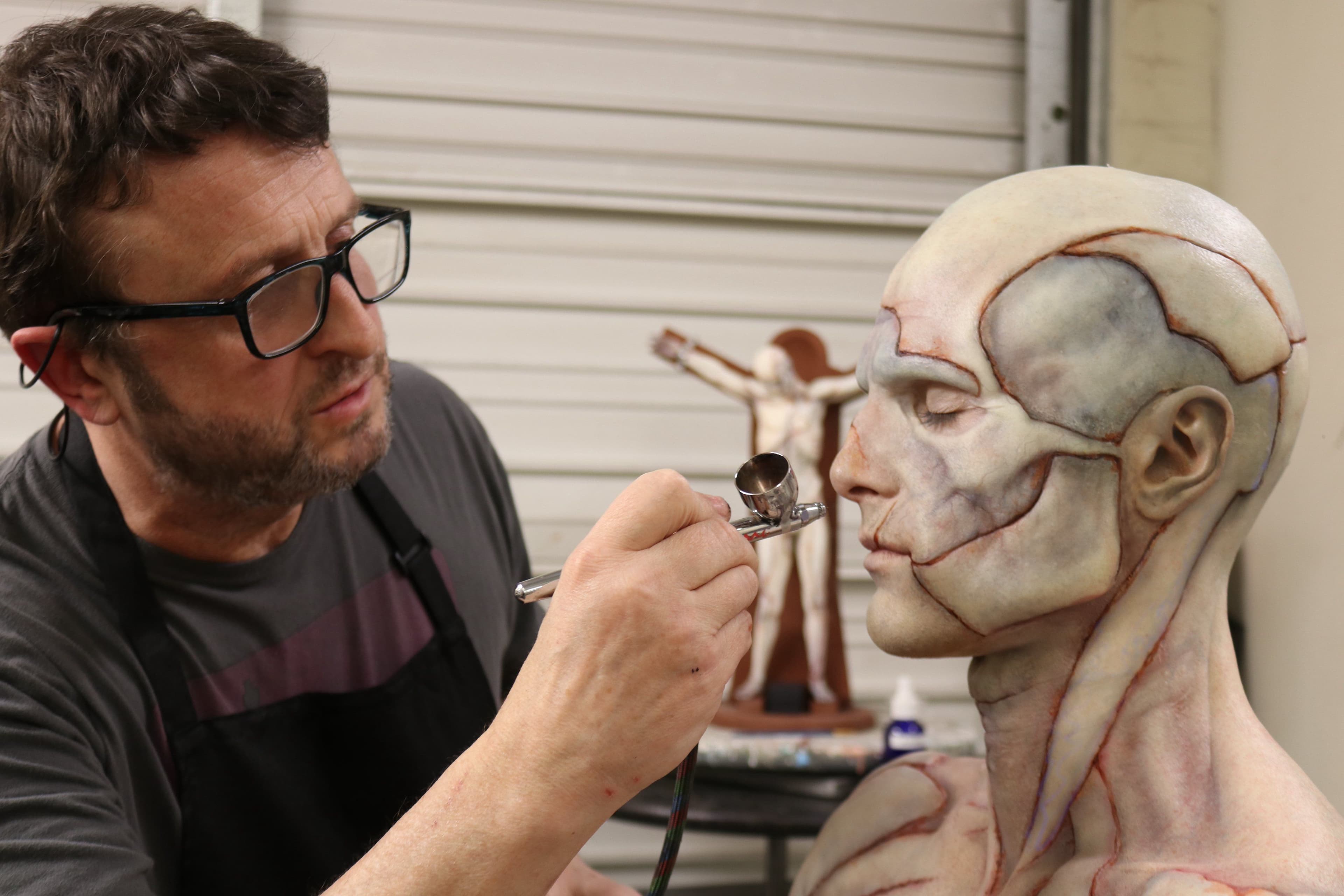 Mike Hill working on Jacob Elordi in the makeup chair for "Frankenstein".
