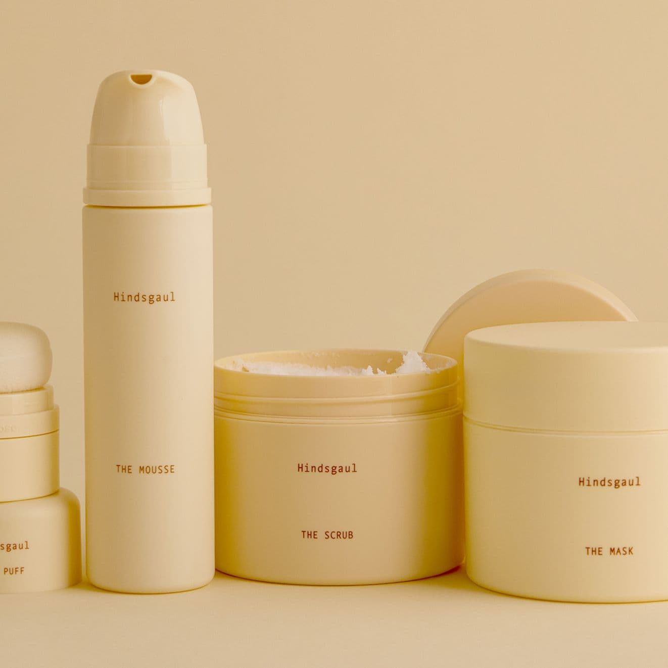 All four Hindsgaul Hair Essentials hair products arranged in a still life
