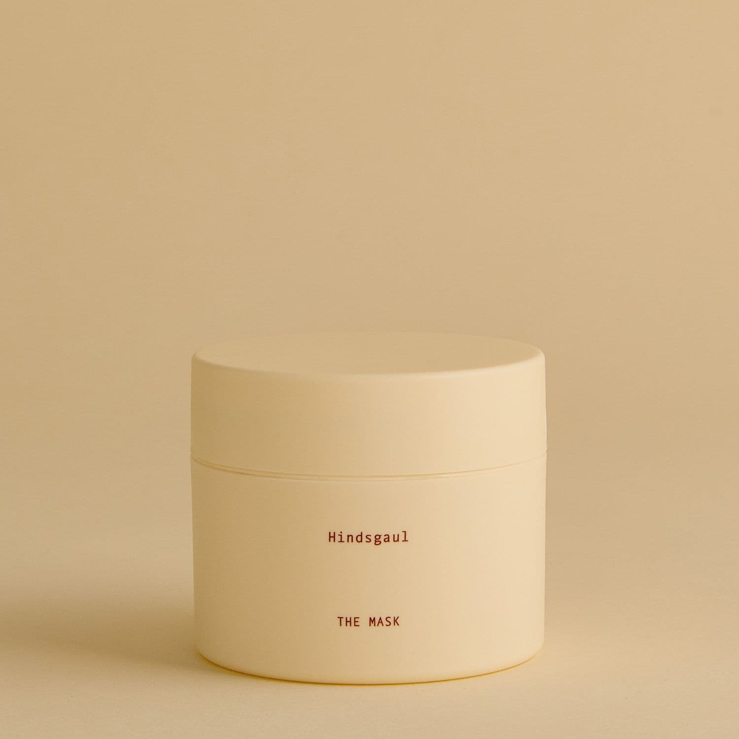 A jar of Hindsgaul Hair The Mask Conditioner against a yellow background