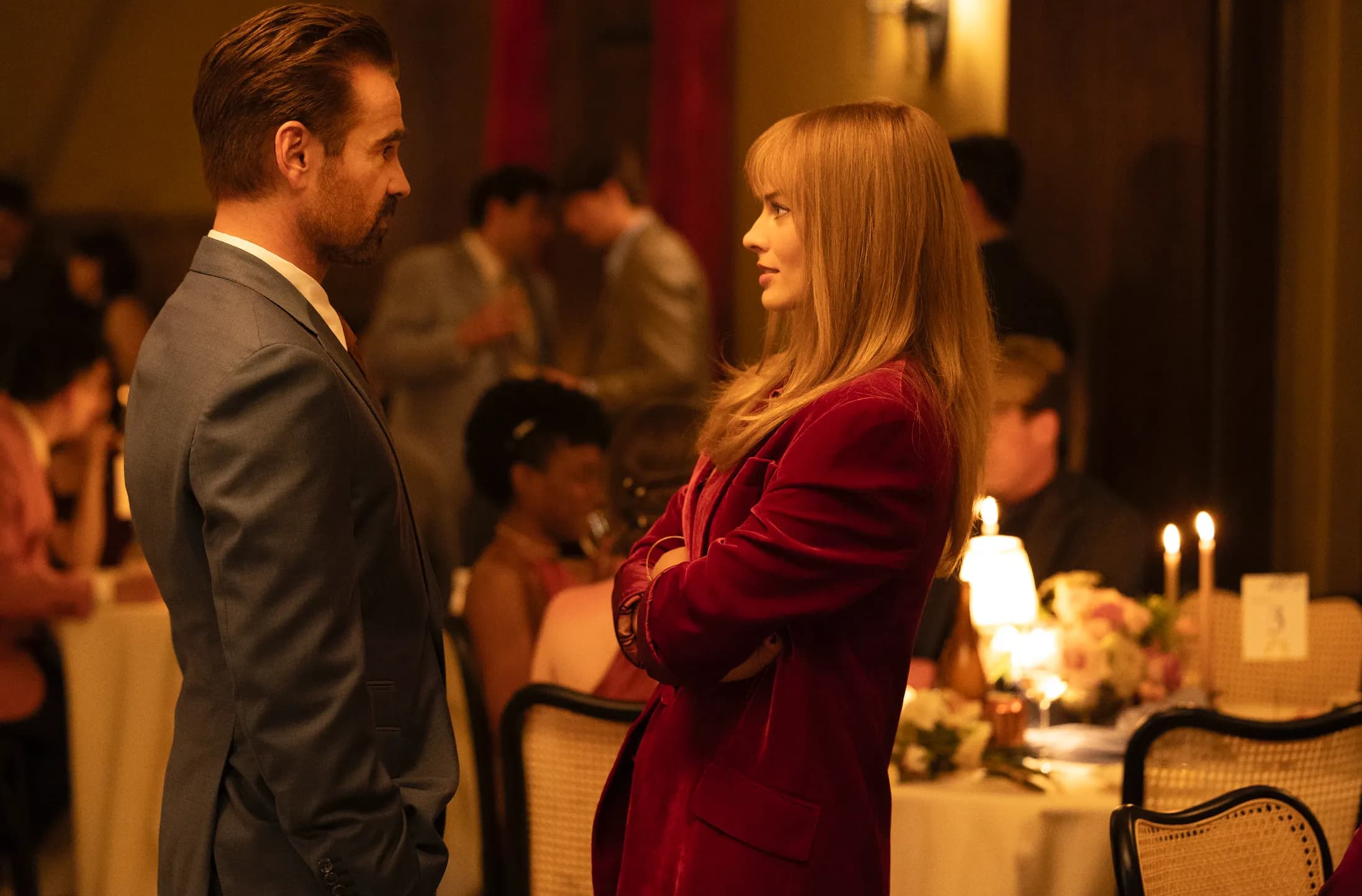 Colin Farrell and Margot Robbie chat while at a wedding in a still from "A Big Bold Beautiful Journey."