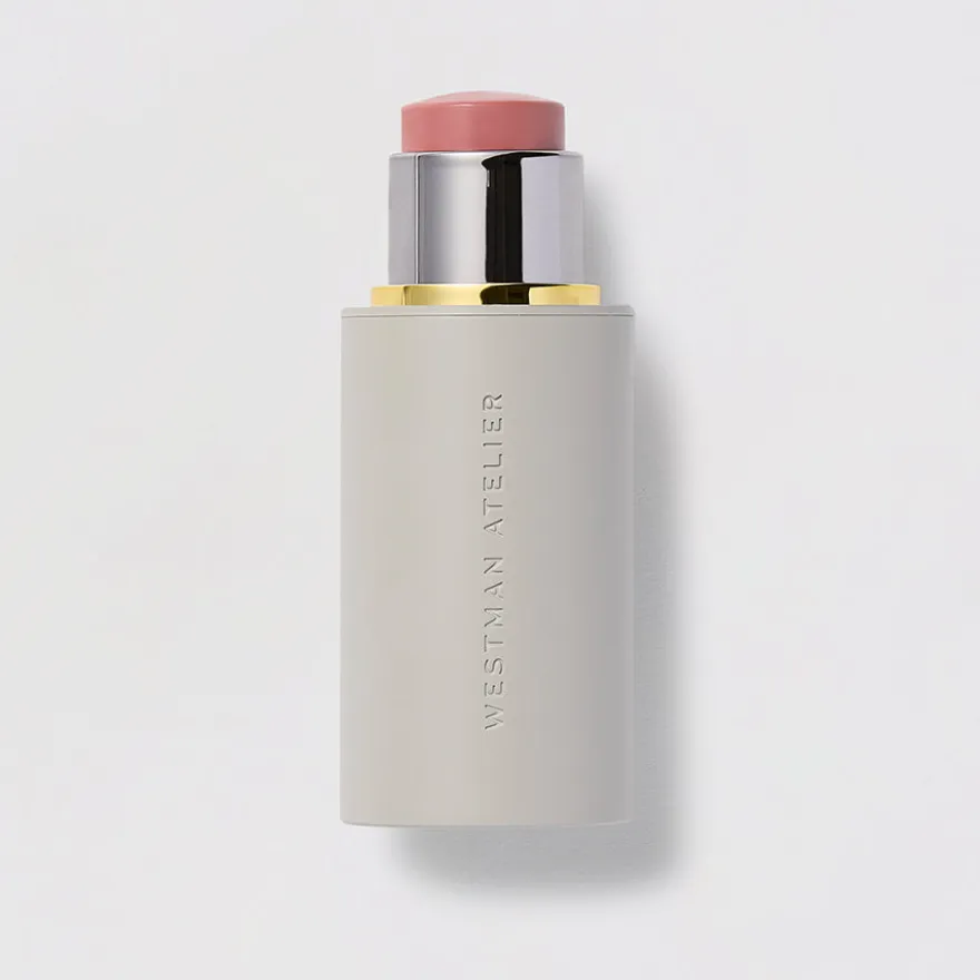 A tube of the Westman Atelier cream blush - a pink tone in a pale gray tube.