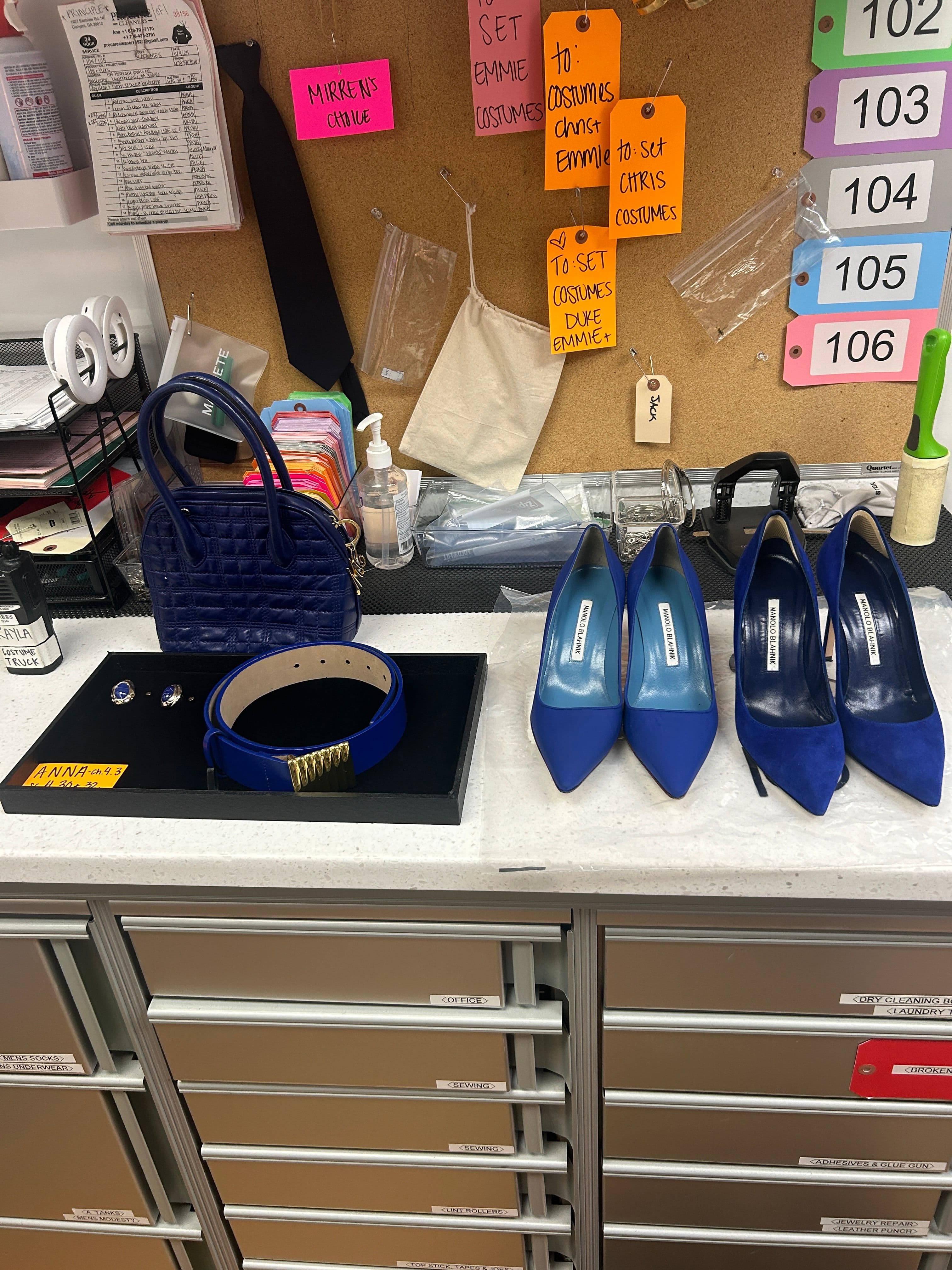 Mirren Gordon-Crozier's work station showing some of Anna's blue outfit accessories.