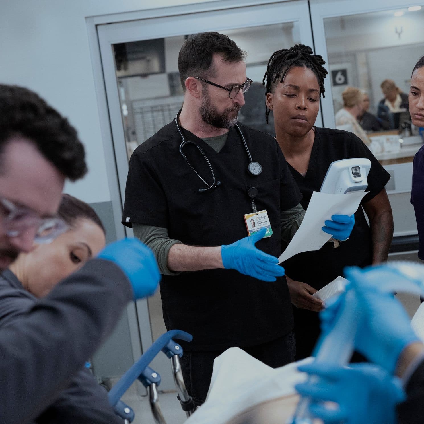 Noah Wyle, Ayesha Harris, and Alexandra Metz in "The Pitt" season two.